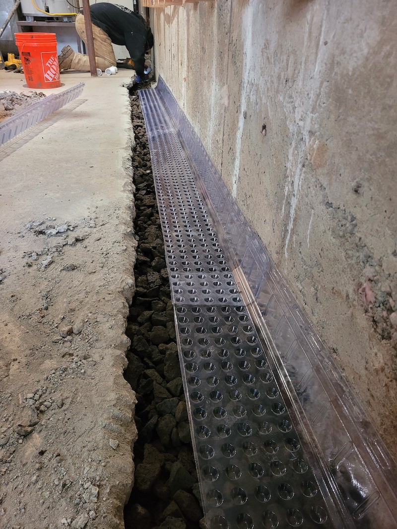 Basement gravel base for concrete.