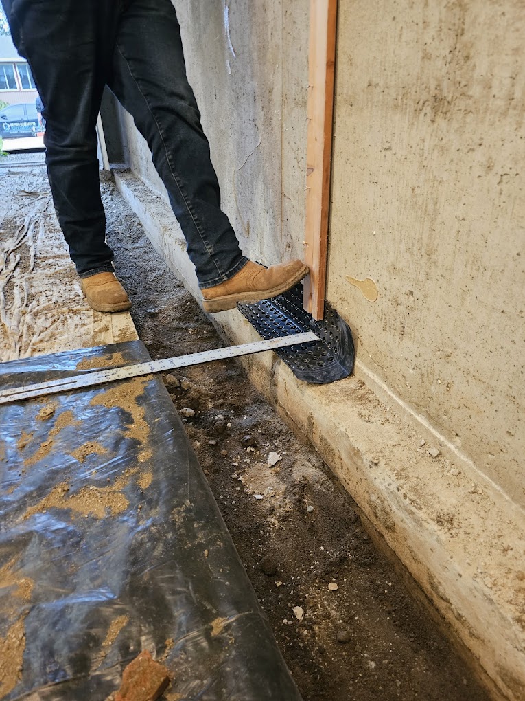 waterproofers digging trench