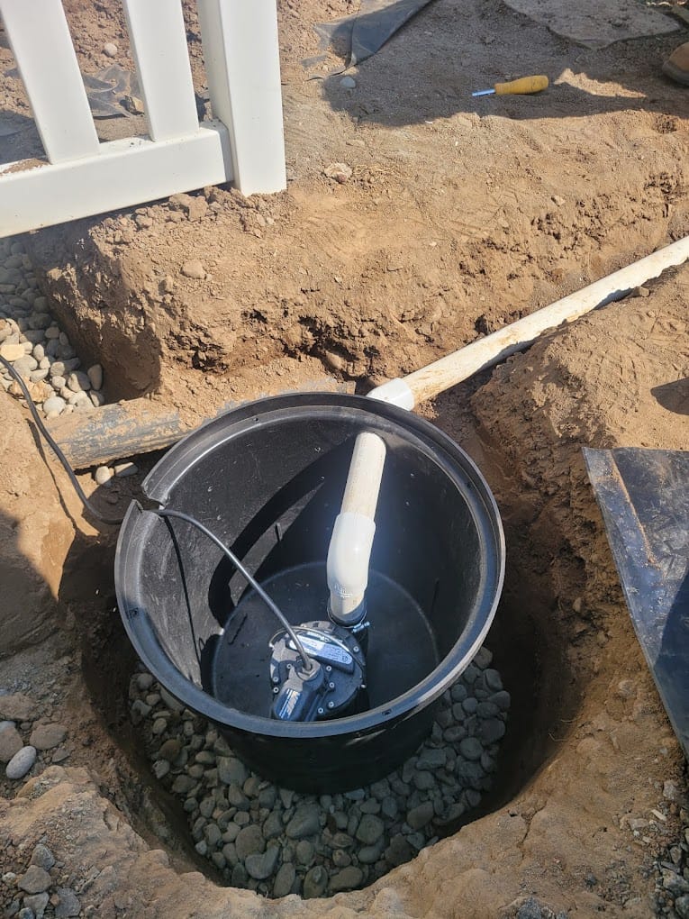 Sump pump installation outdoors