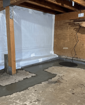 basement with vapor barrier and wet cement
