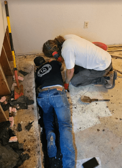 Men working for basement repair company