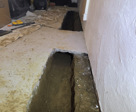 trench dug for basement home waterproofing