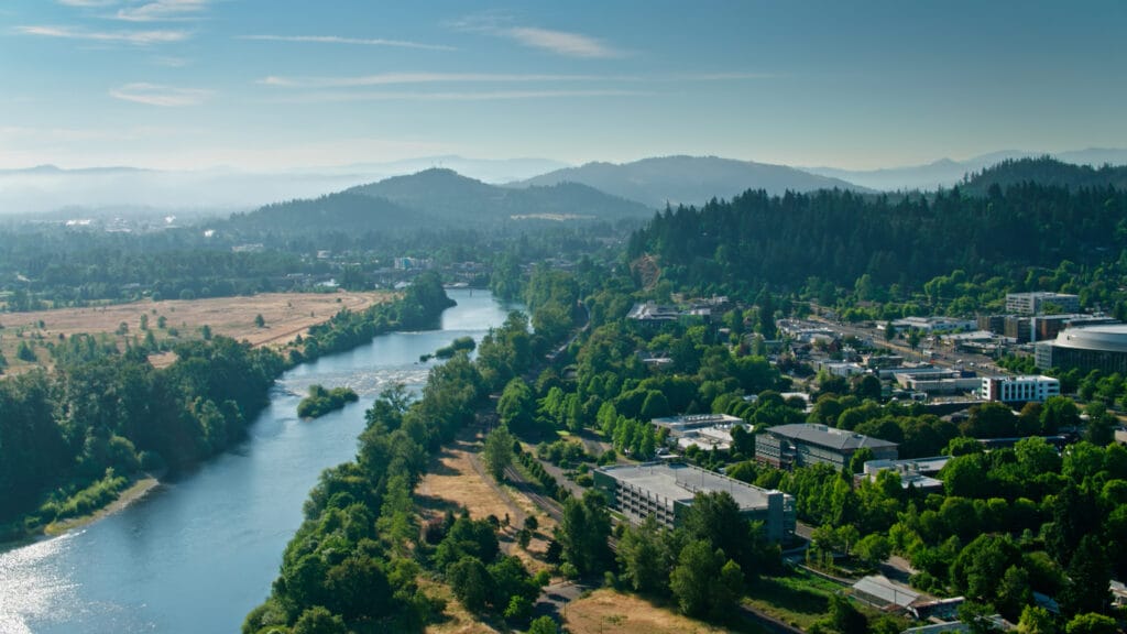Aerial shot of the Willamette River flowing through Eugene, Oregon