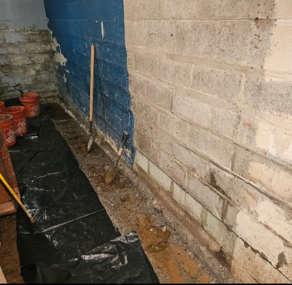 digging trenches to waterproof basement