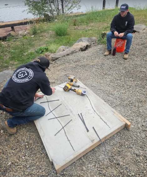 Better basement crew working on cement slab
