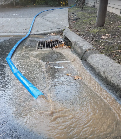water draining in street
