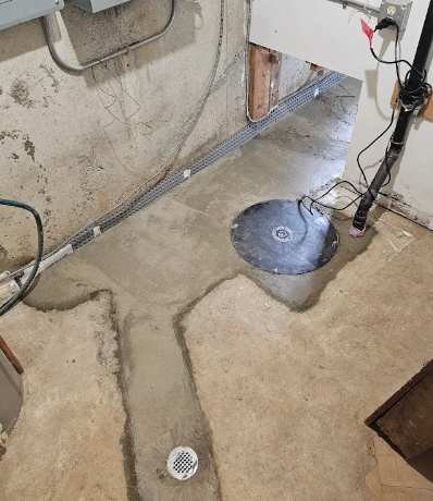 Sump pump in waterproofed basement