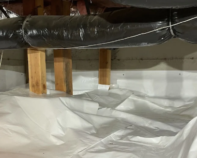 crawl space encapsulated in white plastic to keep out water