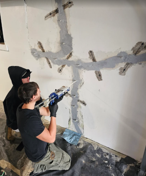 Better basement and waterproofing team fixing foundation cracks