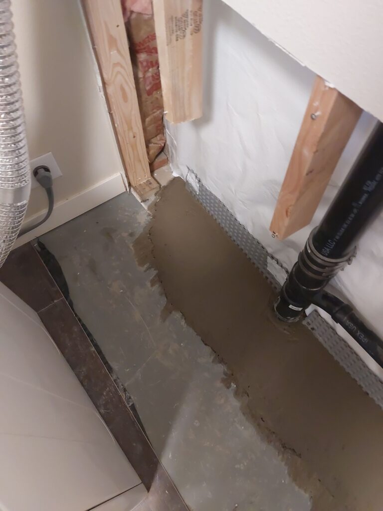 interior perimeter drainage system installation in Portland Oregon basement by Better Basement and Waterproofing