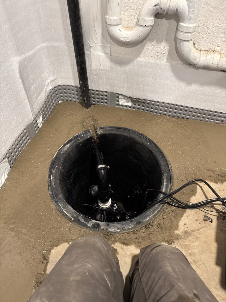 sump pump running constantly in Portland Oregon basement being diagnosed by Better Basement and Waterproofing