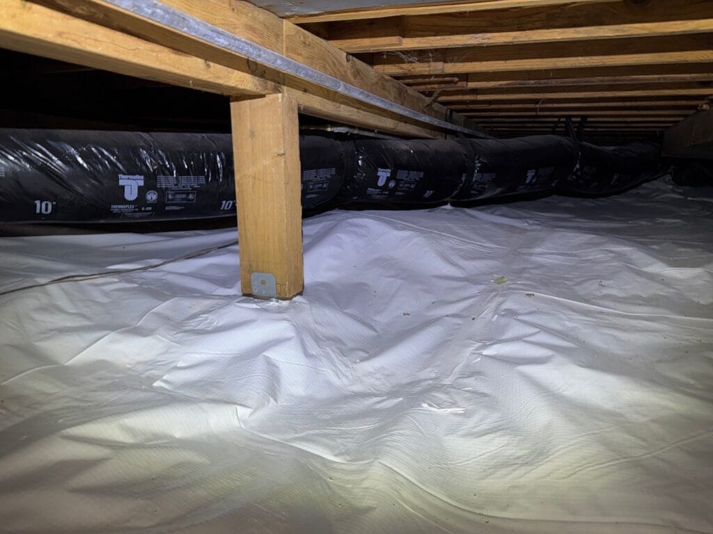 how long does crawl space encapsulation last with white vapor barrier sealed to walls in Portland Oregon home by Better Basement and Waterproofing