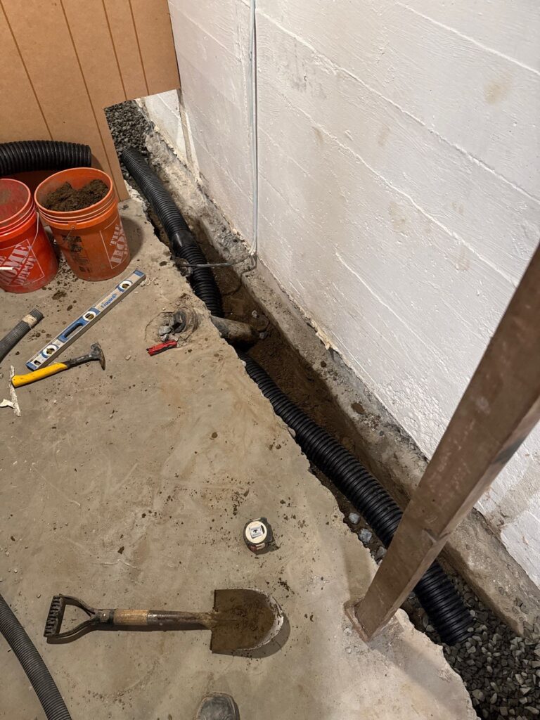 how to insulate basement walls with rigid foam against a dry concrete foundation in Portland